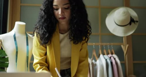 Young woman working creative profession or fashion designer
