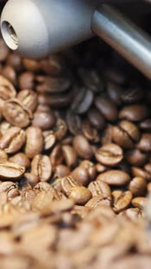 Coffee Beans Getting Stirred in Roaster