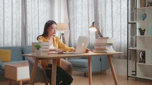 Woman Working at Home on Laptop