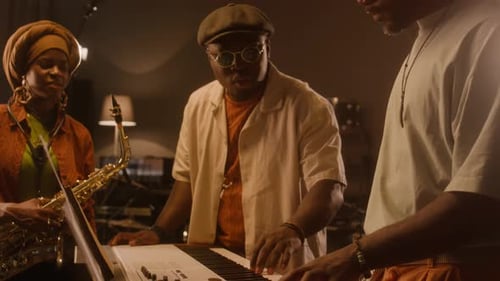 African American Music Band Working on New Tune in Studio