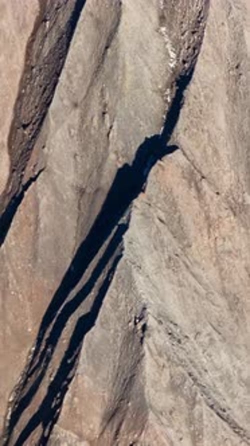 Stunning Aerial View of Rugged British Columbia Mountains From Airplane Perspective