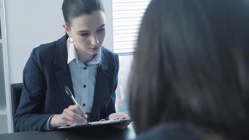 Team Discussing Data in Bright Office Meeting