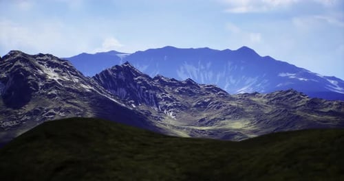 Majestic Mountain Landscape Under a Bright Sky with Rugged Terrain