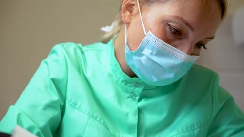 Health Care Worker in Surgical Mask Close-Up