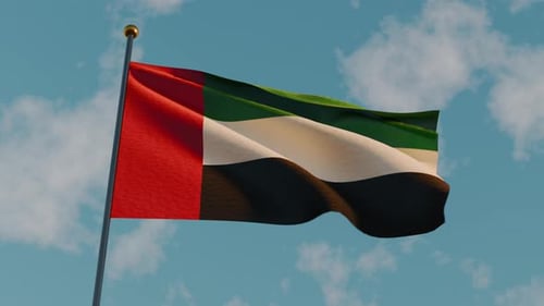 UAE Flag Waving Against a Blue Sky