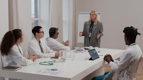 Medical Professionals in Meeting at Conference Table