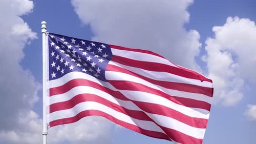 American Flag Waving Against a Blue Sky
