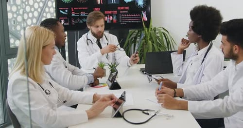 Medical Professionals Collaborating at Office Meeting