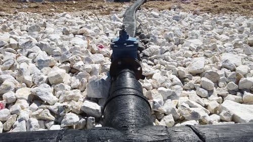 Mining Residuals Flowing into Decanting Pond From a Copper Mine. Geamana, Rosia Montana, Romania