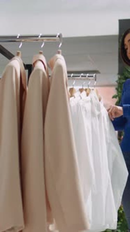 Vertical Video Middle Eastern Store Assistant Offers Fashion Advice to Female Client