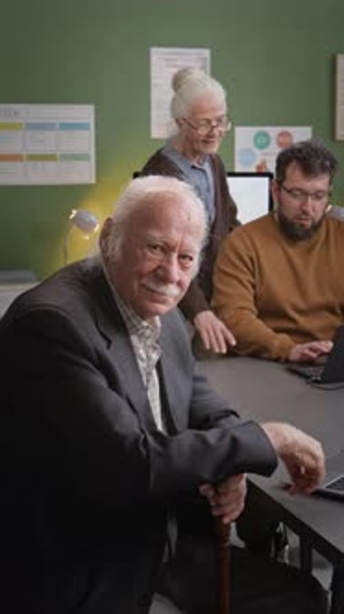 Senior Man Posing in Computer Class Vertical