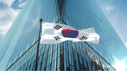 South Korean Flag Waving with Modern Corporate Building Background