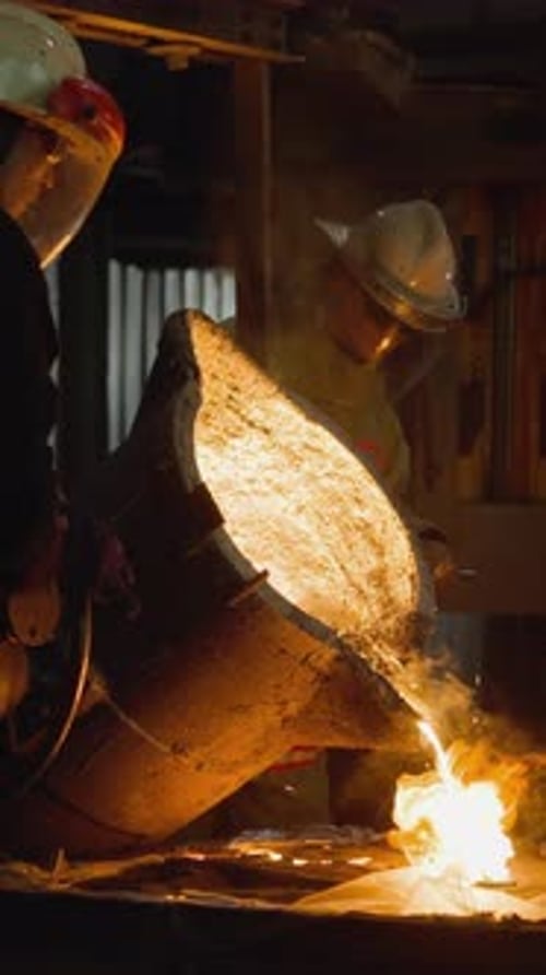 Team Pouring Molten Iron in Foundry