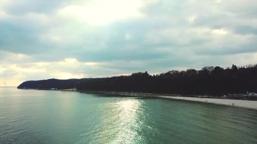 Drone flying near seaside at overcast weather