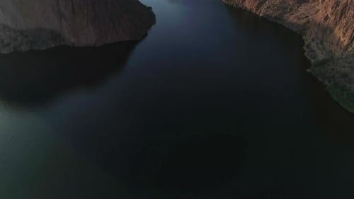 AERIAL - Drone Tilt Up to Reveal Small Dam (Canyon Lake)