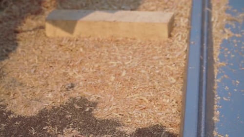 Electric Hand Planer Removing Wood