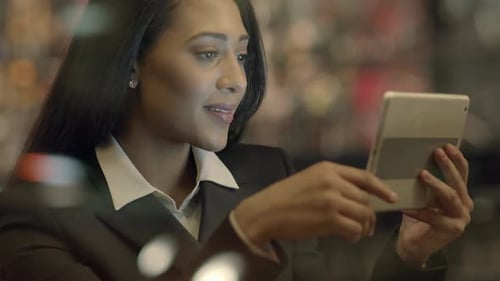 Professional Woman Using Tablet in Urban Setting
