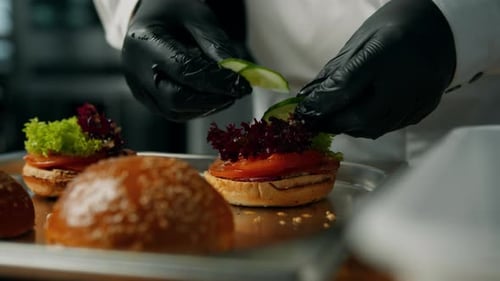 Chef Preparing Sandwiches in Restaurant Kitchen