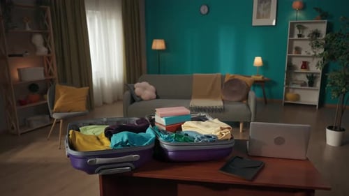 Suitcase Packed with Clothes in Living Room