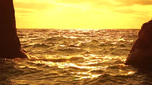 Sea Horizon Line with Waves on Golden Sunset