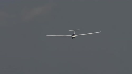 Glider Soaring Through the Air on a Grey Day