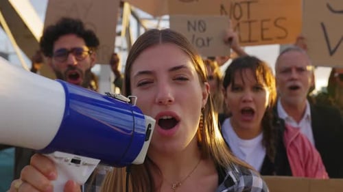 Adults Shouting at Protest Rally with Megaphone