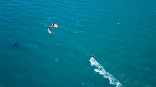 Aerial view of Kite surfer riding the smooth water of The Mediterranean Sea