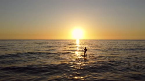 Silhouette Of Surfer Enjoy Standup Paddleboarding In The Ocean During Sunset In Batroun, Lebanon. -
