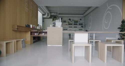 Modern Coffee Shop with Stylish Interior Wooden Tables Seats and Bar Counter