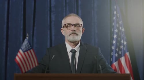 Adult Man At Podium Speaking At Political Event
