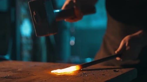 Craftsman Shaping Hot Metal With Hammer Close Up