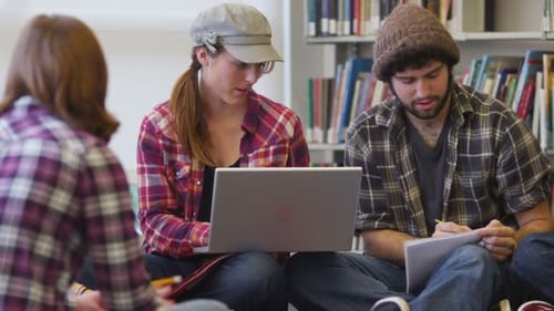 Group Of College Students Studying In Library