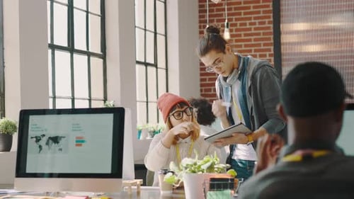 Startup, computer and talking of digital marketing business team planning a website strategy