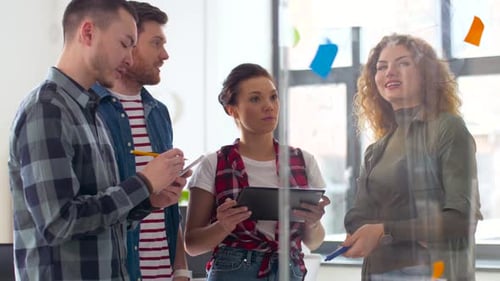Creative Team Collaborating on Project in Modern Office