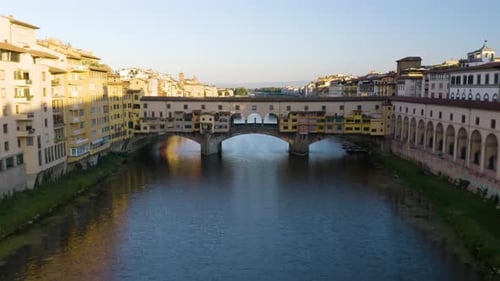 Cinematic Aerial Flight Over Ponte Vecchio Bridge in Tuscan Capital City of Florence, Italy