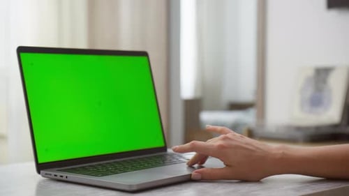 Hand Interacting with Laptop Featuring Chroma Key Green Screen