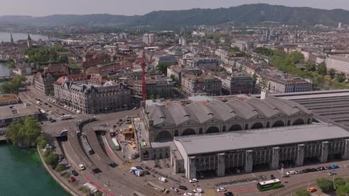 Aerial View of Historic Building of Hauptbahnhof and Surrounding Streets Cars and Trams Passing