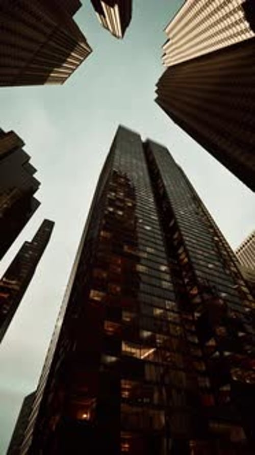 Looking Up at Tall Buildings in a City