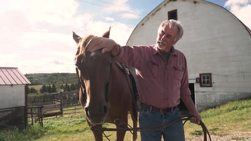 Man with Horse on Farm Grazing Land