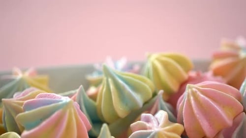 Multicolored Unicorn Meringue Cookies on a White Serving Plate