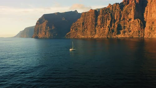 Aerial Relax View of Los Gigantes with White Yacht