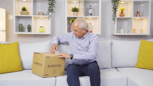 The old man opening the cargo package.