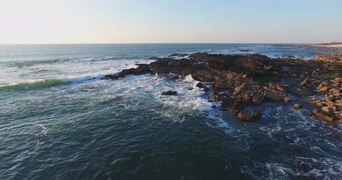 Flying through a rocky beach
