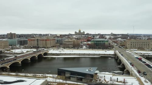 Des Moines River in Winter with State Capitol Building in Background. Aerial Establishing Shot