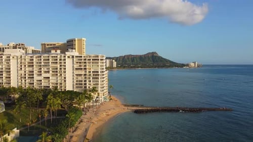 Aerial View Honolulu Skyline with Oceanfront Resorts Fort DeRussy Beach with Golden Sand Palm Trees