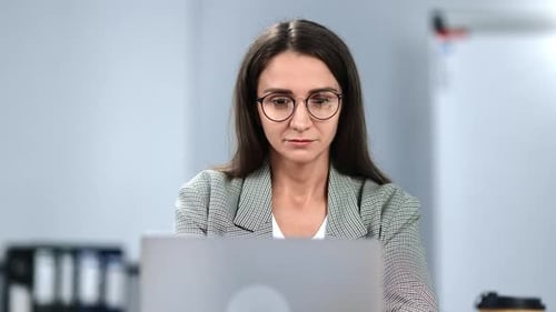 Stylish Brunette Young Woman in Glasses Working Online Laptop Desk Modern Office Workplace Closeup