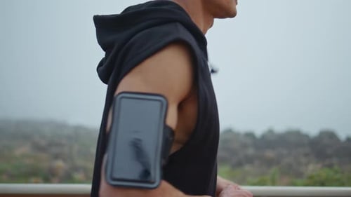 Man Body Running Outdoors with Sport Accessory Closeup Sporty Guy Jogging Park