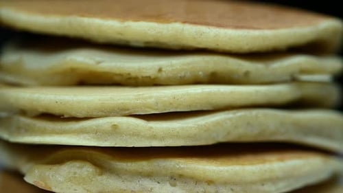 Honey Drizzles Over Golden Pancake Stack