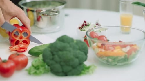Preparing Salad with Fresh Vegetables at Home