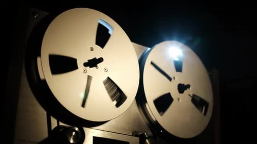 Reel to Reel Audio Recorder Spinning in Dark